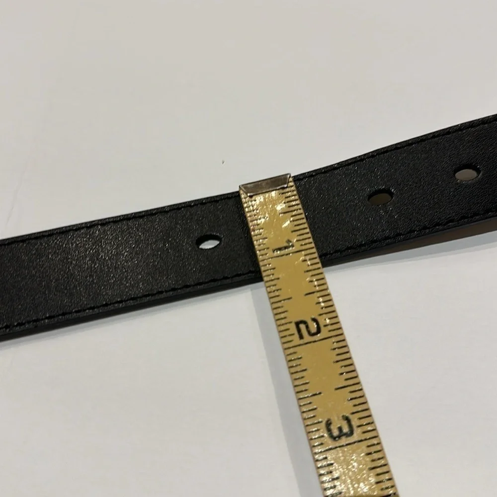 Black Vegan leather belt with silver tone buckle fits approximately 31-36”
